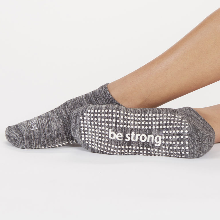 Grip socks with "be strong" on the sole